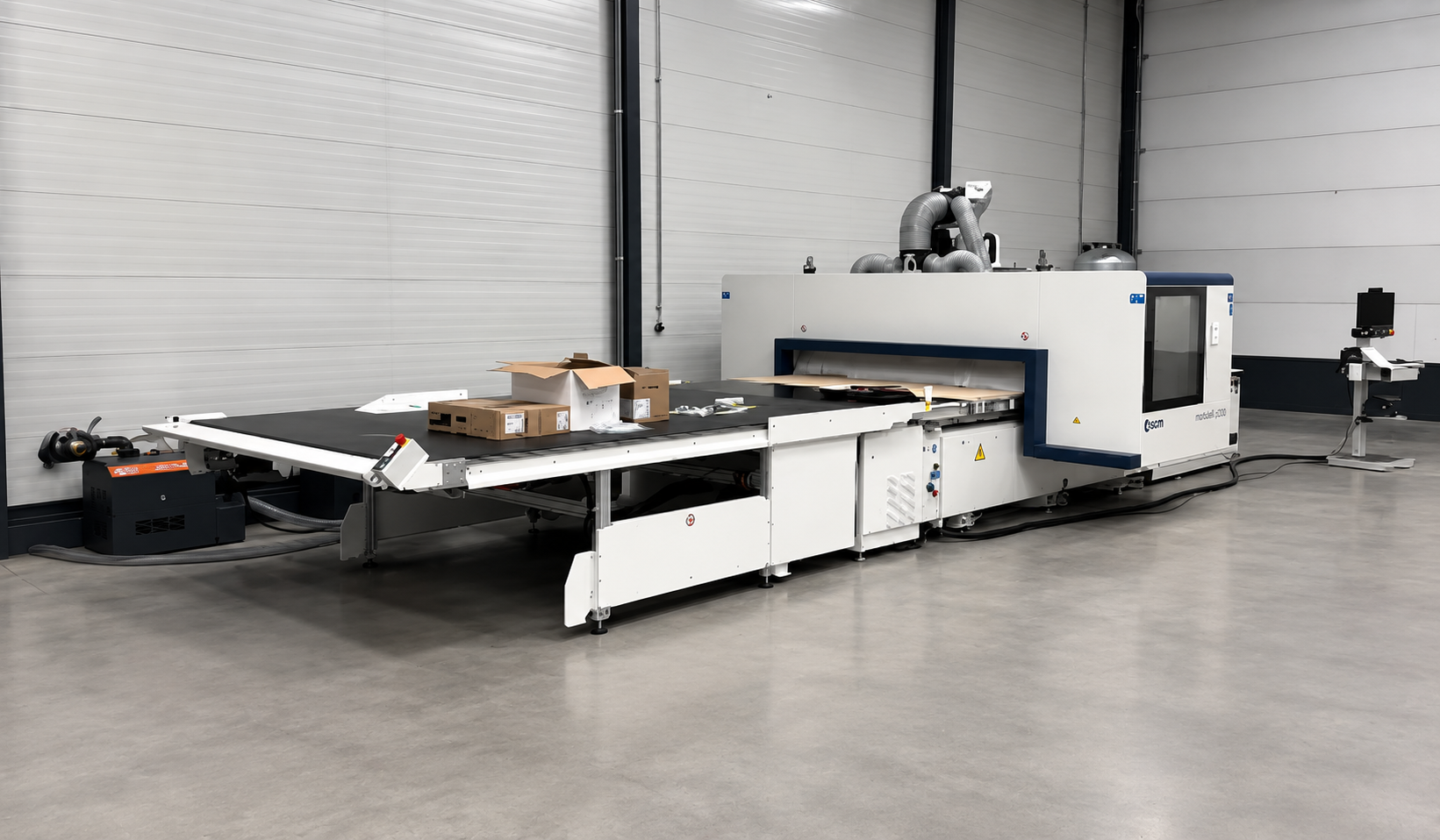 Een kijkje in de werkplaats van Van der Voet maatwerk, met de machine waarmee aan maatwerk wordt gewerkt.
